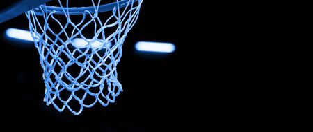 Basketball hoop isolated on black background. Blue filterの写真素材