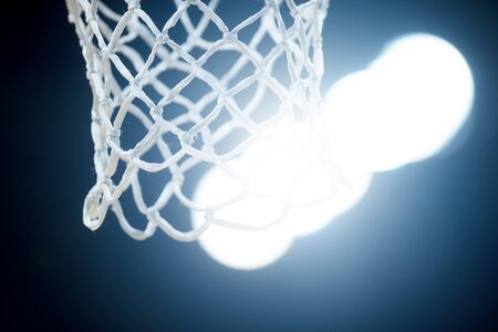 Empty Swooshing Basketball Net Close Up with Dark Backgroundの写真素材