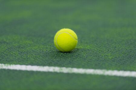 soft focus of tennis ball on tennis grass courtの写真素材