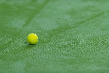 soft focus of tennis ball on tennis grass courtの写真素材