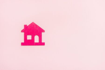 Pink house on pink background. New home conceptの写真素材