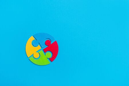 Colorfull puzzles piece on blue background. World Autism Awareness Day Conceptの写真素材