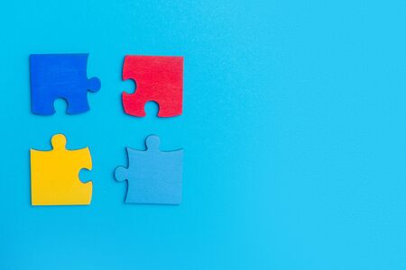 Colorfull puzzles piece on blue background. World Autism Awareness Day Conceptの写真素材