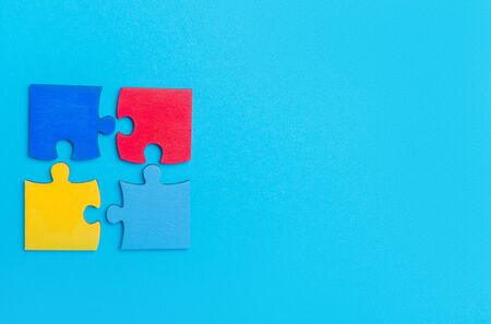 Colorfull puzzles piece on blue background. World Autism Awareness Day Conceptの写真素材