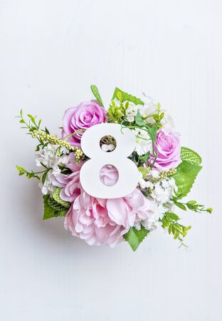 Layout with colorful flowers, leaves and number eight. Flat lay. Top view.の写真素材