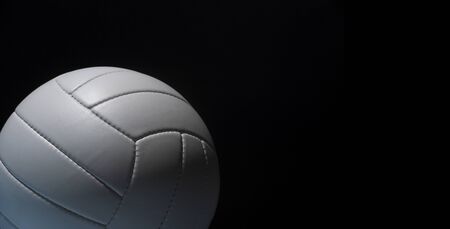 White leather volleyball detail on black backgroundの写真素材