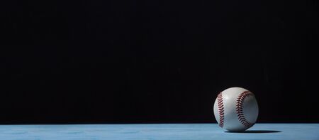 Baseball Ball On  Blue Wooden Tableの写真素材