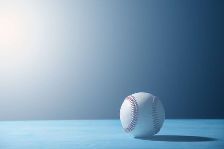 Baseball Ball On  Blue Wooden Tableの写真素材