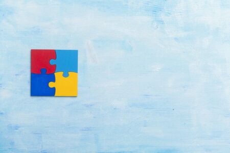 Colorfull puzzles piece on blue background. World Autism Awareness Day Conceptの写真素材