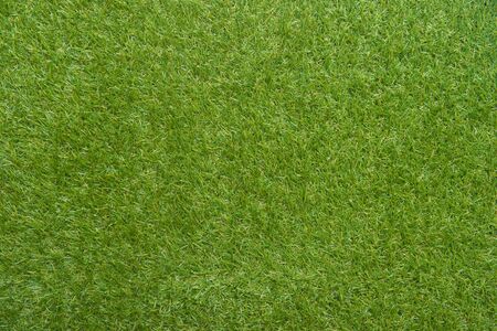 Green wall and green background of artificial grass designed for outdoor sports.の写真素材