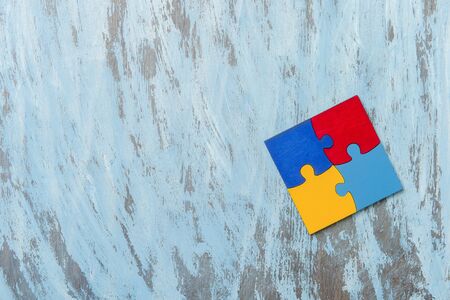 Colorfull puzzles piece on blue background. World Autism Awareness Day Conceptの写真素材