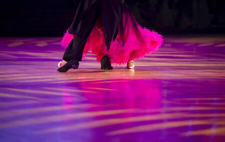 Woman in pink gown and man black tailcoat. Latino dancingの写真素材