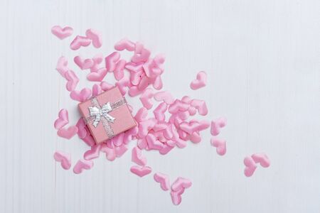 Gift box with hearts on a white wooden background. Valentine`s day.の写真素材