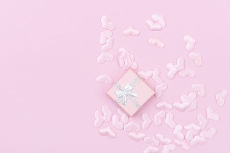 Gift box with hearts on a pink background. Valentine`s day.の写真素材