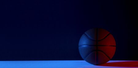 Basketball ball isolated on black background. Blue neon Banner Art conceptの写真素材