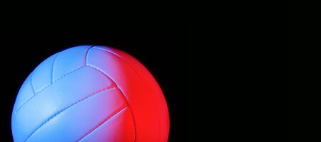 Volleyball ball isolated on black background. Blue neon Banner Art conceptの写真素材