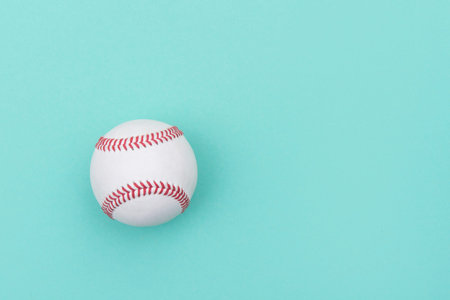Baseball ball on green background. 