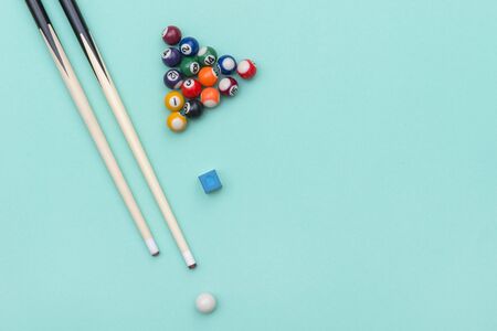 Pool Billiard equipments on a green background.の写真素材
