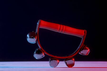 Hand bells musical instrument for ringing on black backgroundの写真素材