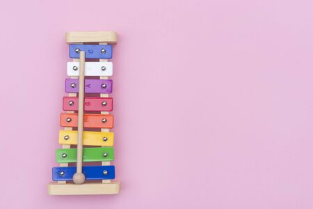 Colour xylophone isolated on pink backgroundの写真素材