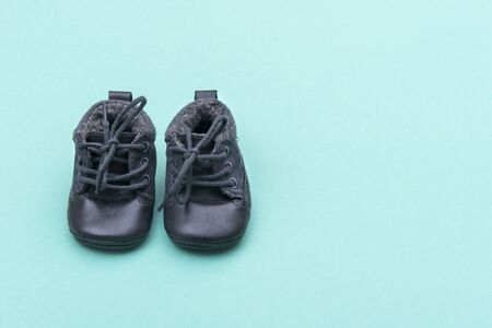 Shoes on bright green background in child's roomの写真素材