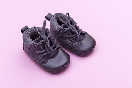 Shoes on bright pink background in child's roomの写真素材