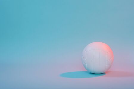 Volleyball ball isolated on neon background. Banner Art concept. Competition, draw.の写真素材