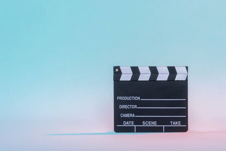 Movie clapper on neon background, cinema concept.の写真素材