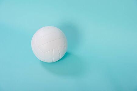 Volleyball ball isolated on blue background.の写真素材