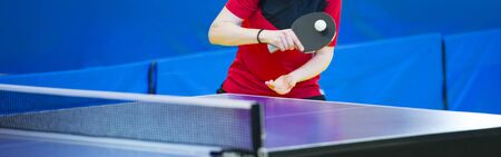 table tennis  racket and ball in a sport hallの写真素材