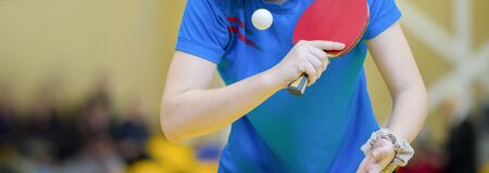 playing table tennis  racket and ball in a sport hallの写真素材