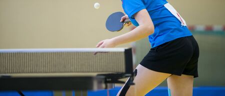 playing table tennis  racket and ball in a sport hallの写真素材