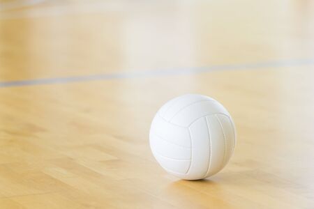 Volleyball with white color on Wooden Courtの写真素材