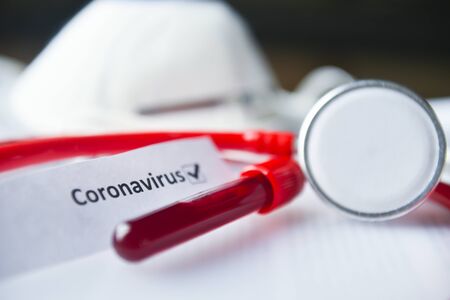 2019-nCoV and Coronavirus blood test in Laboratory Coronavirus test list medical form, mask,test blood tubes stethoscope on documents の写真素材