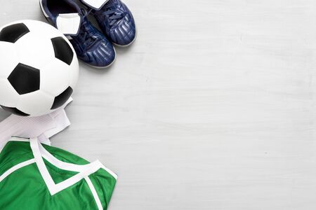 Soccer equipment on grey wooden background. Kids sport concept.の写真素材