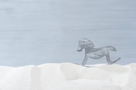 Horse shape in the sand on grey backgroundの写真素材