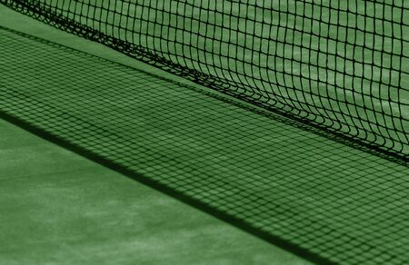 Tennis net and green court. Individual sportの写真素材
