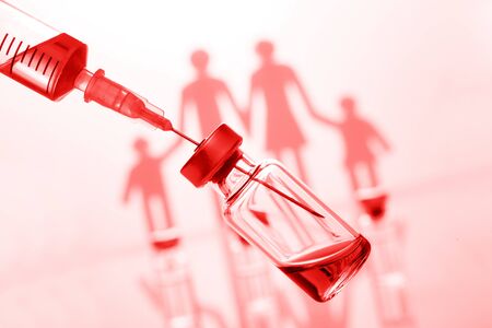 Protection against viruses and infections. Immunization and vaccination in family. Red color filterの写真素材