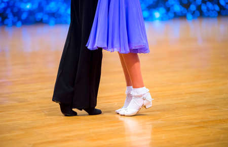 Attractive young couple of children dancing ballroom dance. Girl and boy dancer latino international dancing.の写真素材
