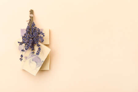 Natural handmade soap with dried lavender and essential oil on pink background. Zero waste conceptの写真素材