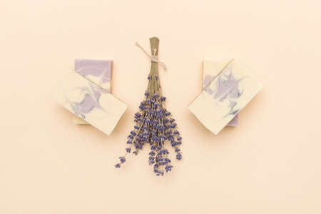 Natural handmade soap with dried lavender and essential oil on pink background. Zero waste conceptの写真素材