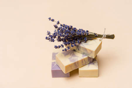 Natural handmade soap with dried lavender and essential oil on pink background. Zero waste conceptの写真素材