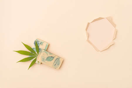 Homemade hemp soap and green leaf of marijuana. Spa organic soap. Organic skincare product with medicinal CBD. Zero waste conceptの写真素材