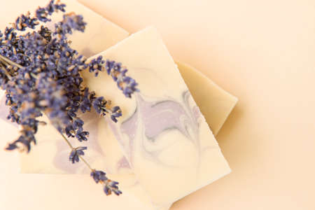 Natural handmade soap with dried lavender and essential oil on pink background. Zero waste conceptの写真素材