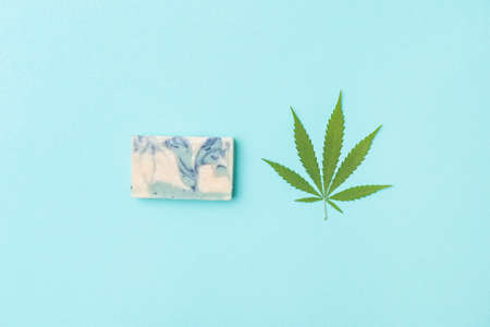 Homemade hemp soap and green leaf of marijuana. Spa organic soap. Organic skincare product with medicinal CBD. Zero waste conceptの写真素材