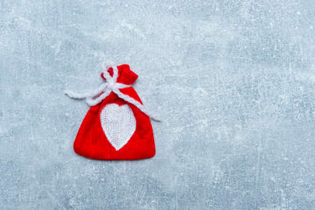 Red bags on grey backgroundの写真素材