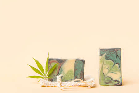 Homemade hemp soap and green leaf of marijuana. Spa organic soap. Organic skincare product with medicinal CBD. Zero waste conceptの写真素材