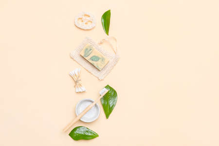 Zero waste bathroom accessories on cream color background. Natural eco bamboo product. Plastic free beauty essentials.の写真素材