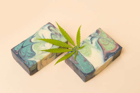 Homemade hemp soap and green leaf of marijuana. Spa organic soap. Organic skincare product with medicinal CBD. Zero waste conceptの写真素材