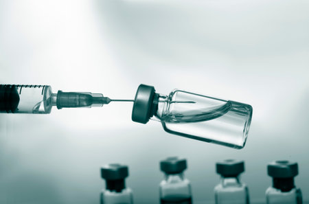 Medical concept Vaccination vaccine vial dose flu shot drug needle syringe. Green color filterの写真素材